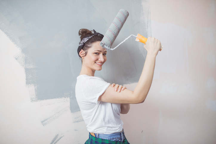 Young woman painting walls - Colormaker Industries