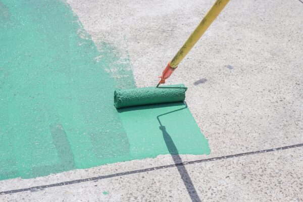 Hand,Painting,A,Green,Floor,With,A,Paint,Roller,For