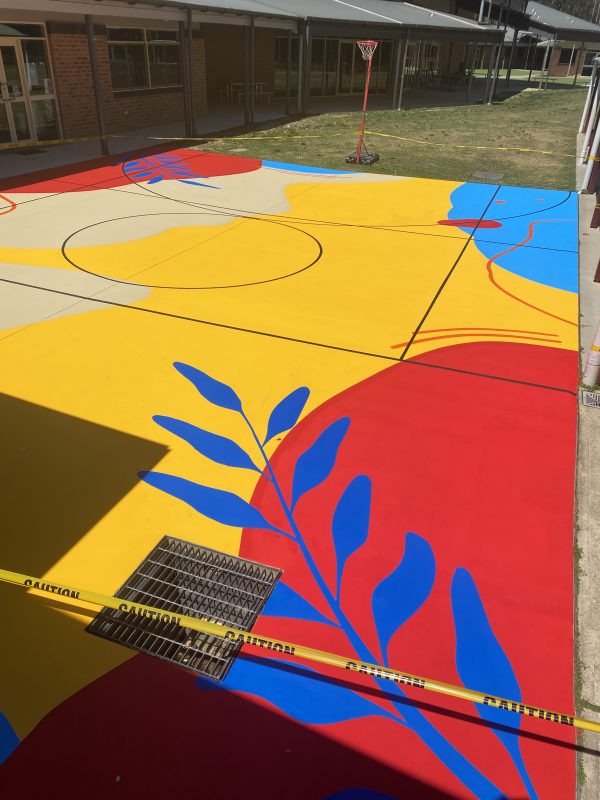 Sportscote PFR on sports court at Nambucca Valley Christian School_Beachsand, Sports Blue, Rainbow Light Blue, Rainbow Red, Rainbow Orange, Black_October 2023